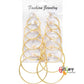 Juego de aretes dorados, estilo tipo argollas