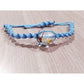 Pulsera tejida celeste con flores secas