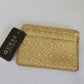 Tarjetero Guess, color oro.
